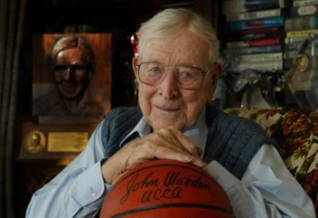 John Wooden with a UCLA Basketball